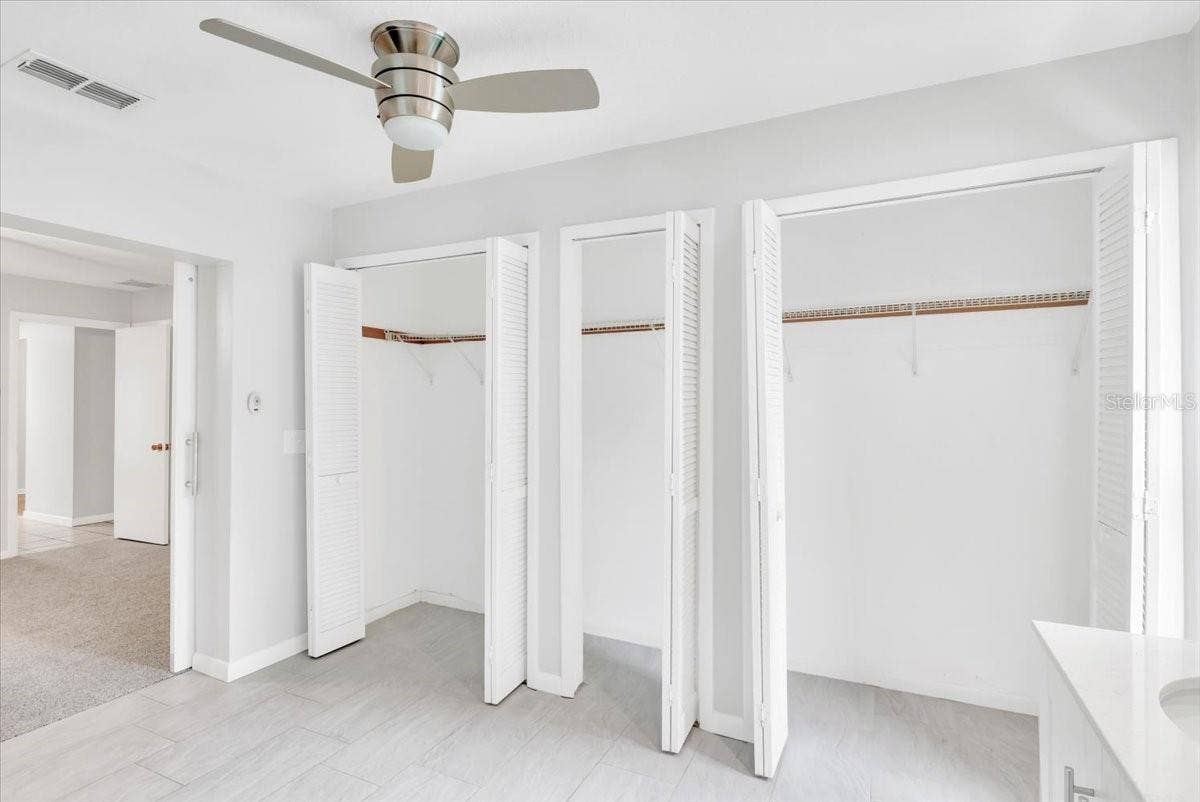 715 S RANGER BOULEVARD, Winter Park, FL 32792 Primary bathroom storage closets.