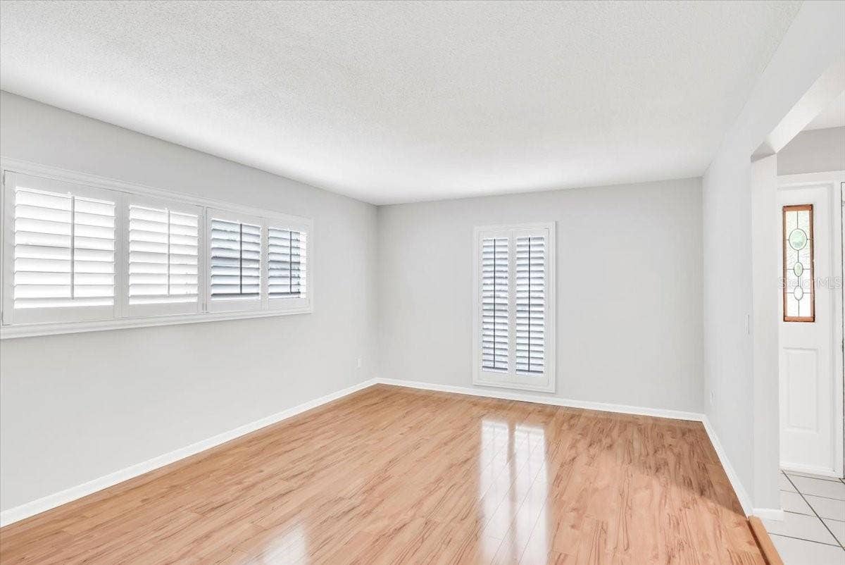 715 S RANGER BOULEVARD, Winter Park, FL 32792 Living area #2 with upgraded hardwood floors and plantation style shutters.