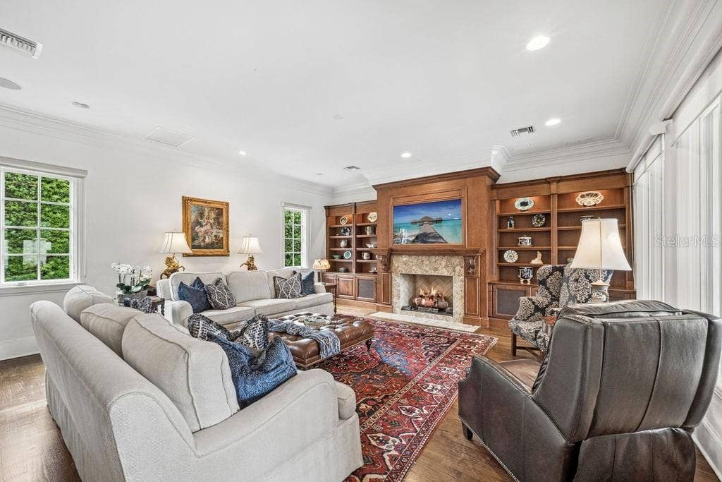 1571 WOODLAND AVENUE, Winter Park, FL 32789 Living room with gas fireplace and custom wood work