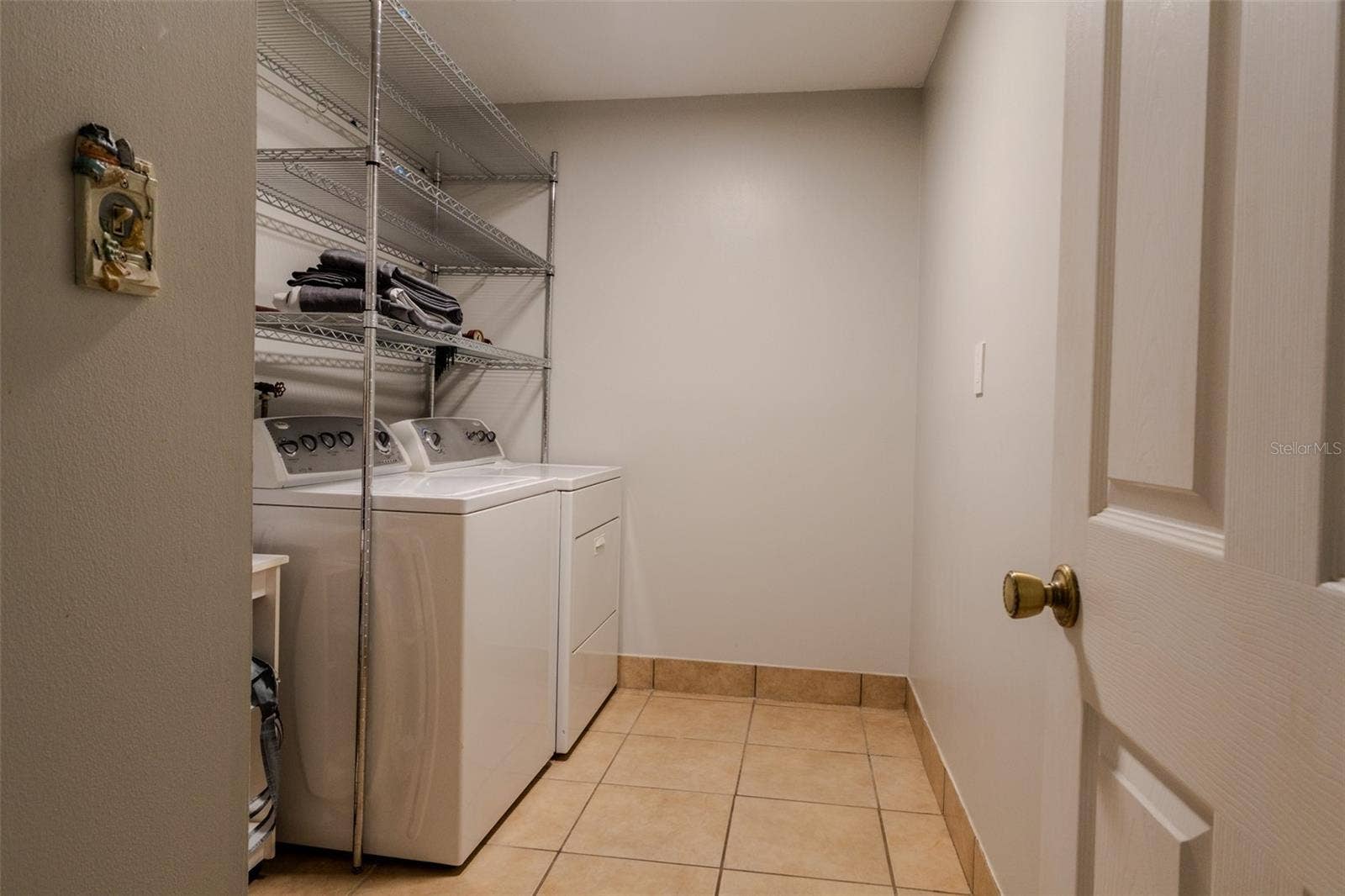 1861 CROWLEY CIRCLE E, Longwood, FL 32779 Laundry room with washer and dryer
