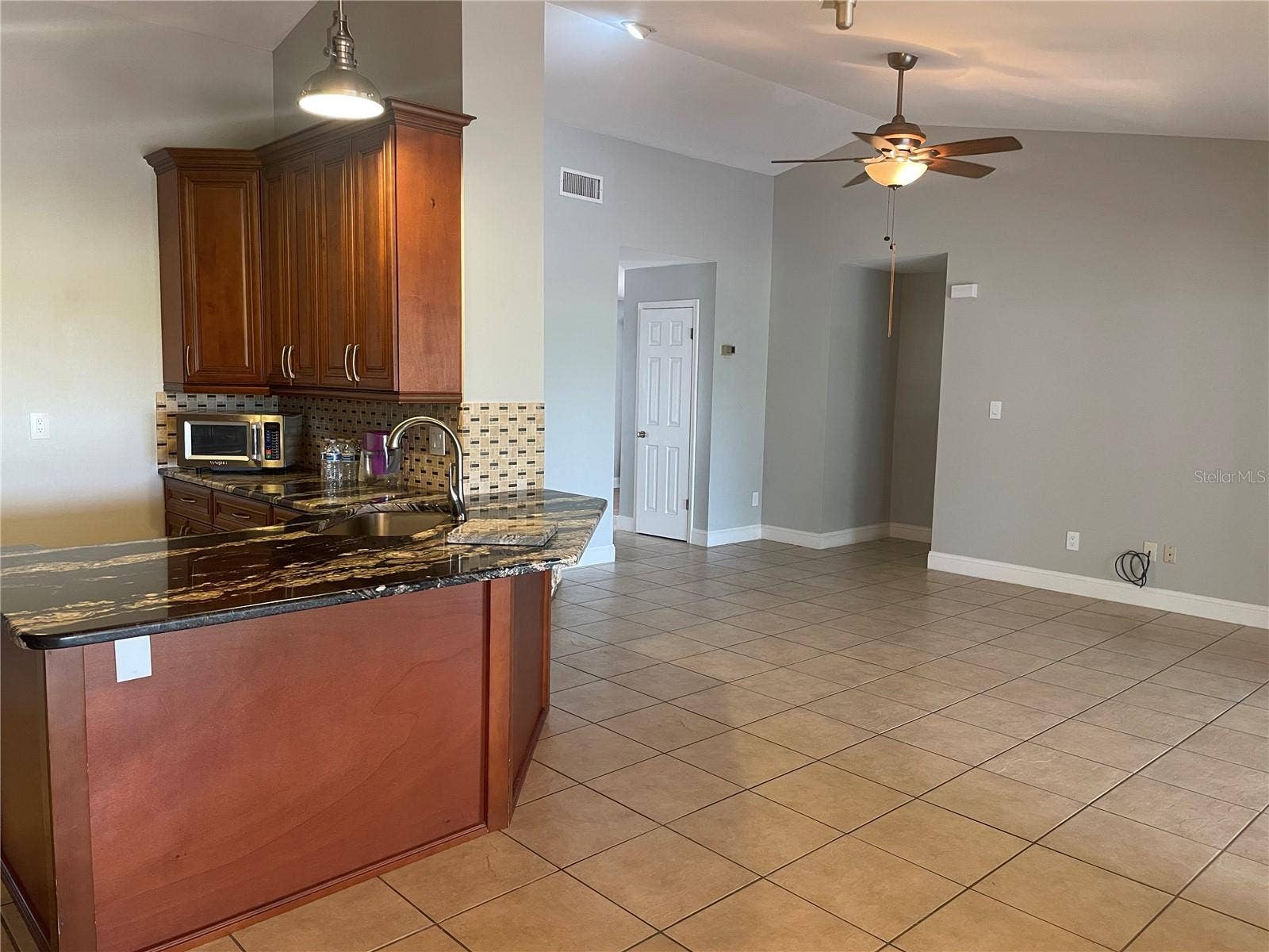 1861 CROWLEY CIRCLE E, Longwood, FL 32779 Breakfast bar with granite countertops
