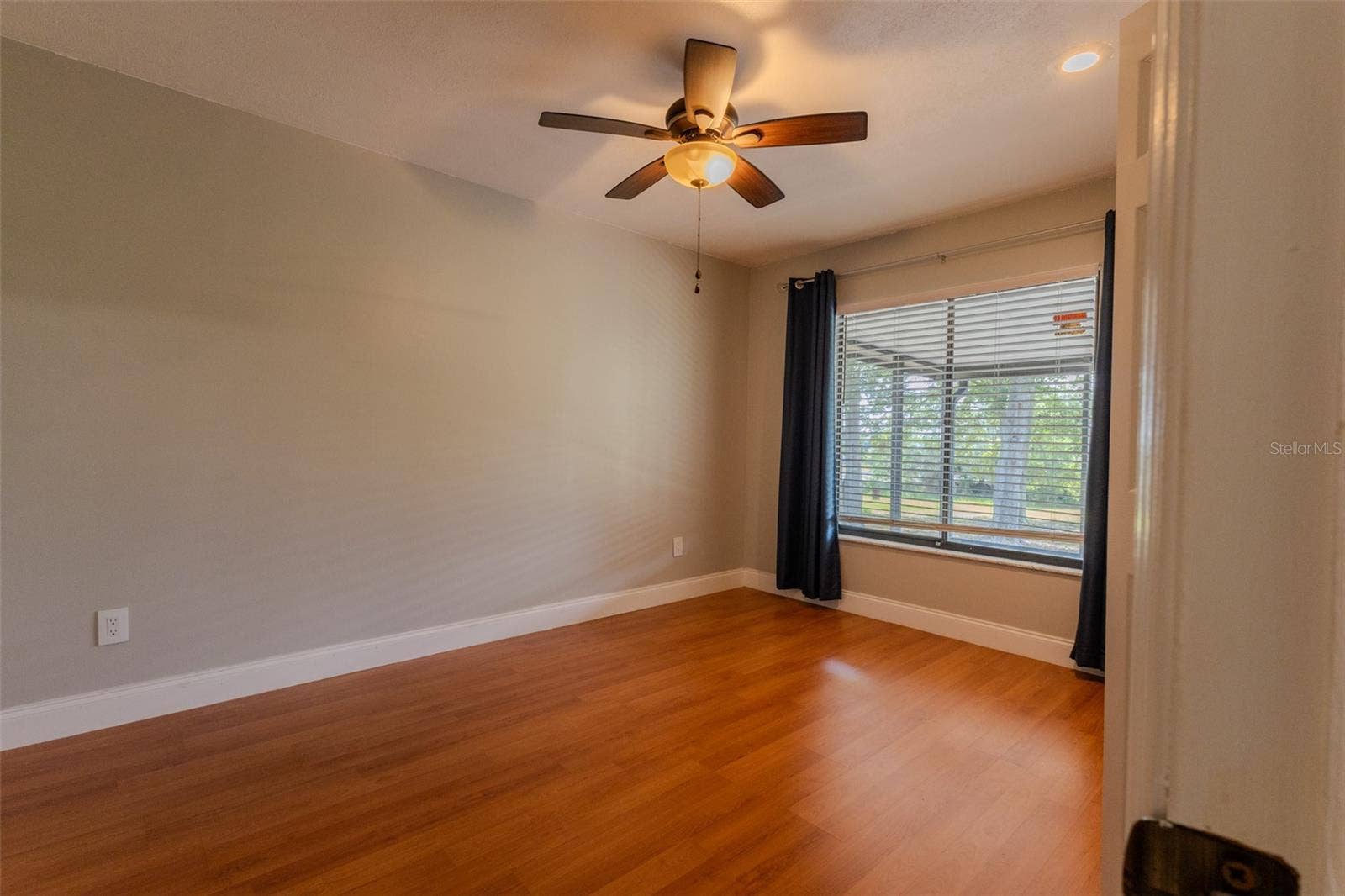 1861 CROWLEY CIRCLE E, Longwood, FL 32779 Split-side guest bedroom 2 with window facing lanai