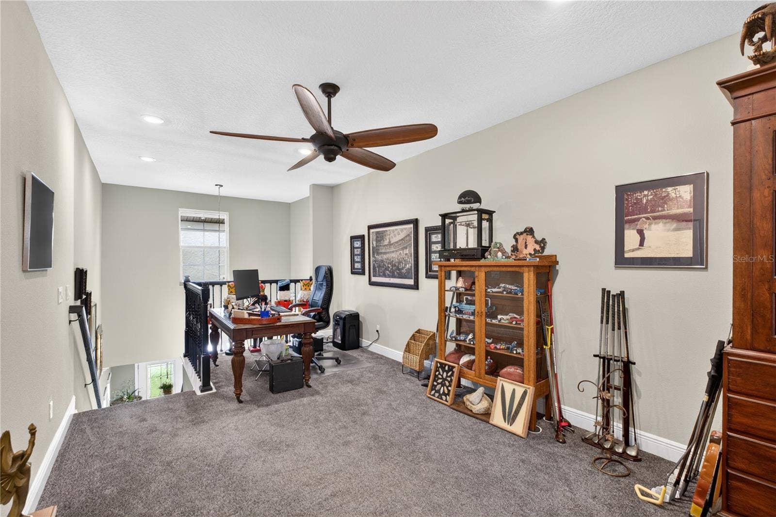1651 AMSEL FALLS PARK TERRACE, Winter Garden, FL 34787 This photo features the staircase leading to the upper level, which is fully carpeted and includes a designated entertaining area.