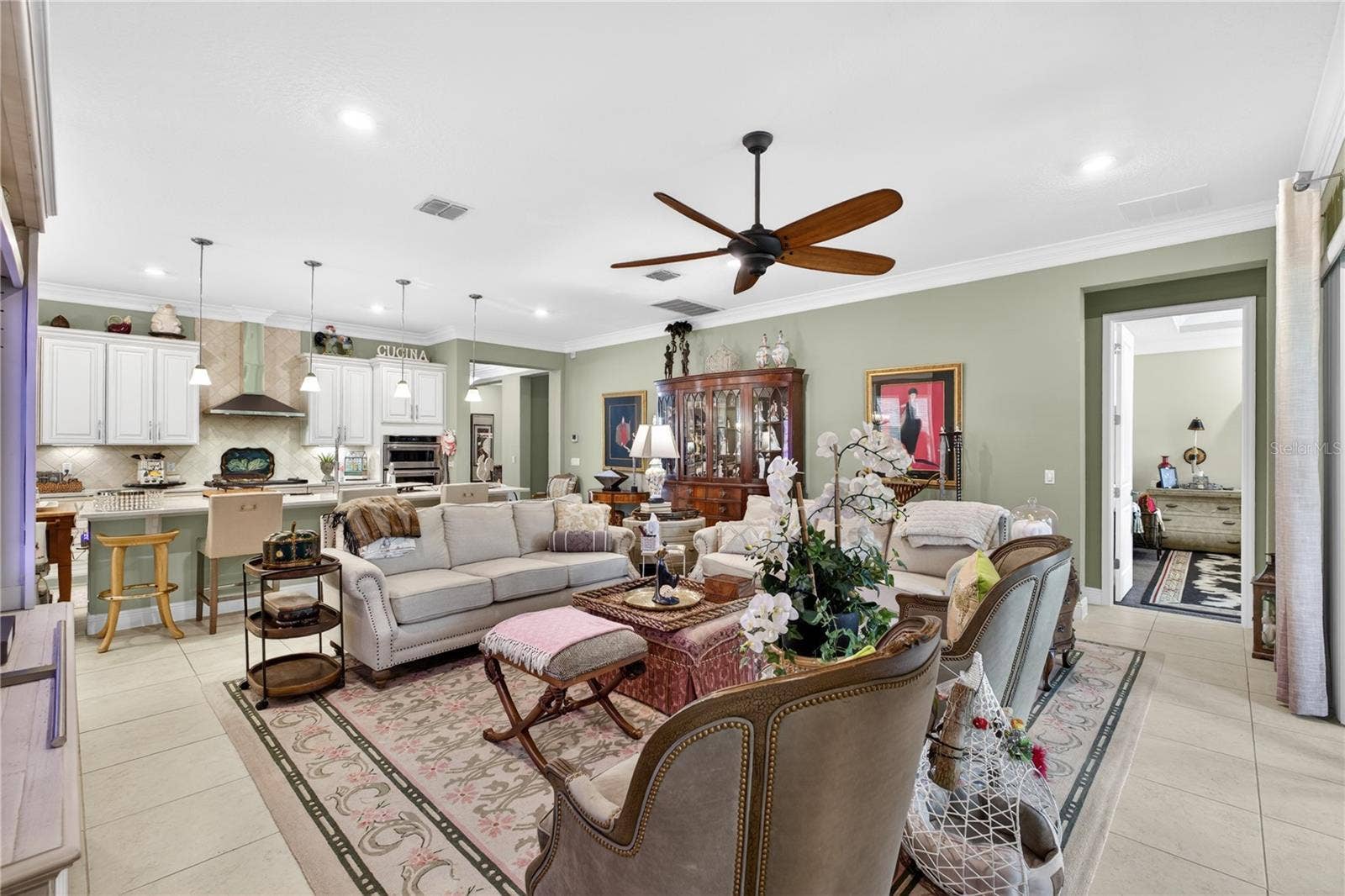 1651 AMSEL FALLS PARK TERRACE, Winter Garden, FL 34787 Open-concept floor plan featuring the kitchen and family room.
