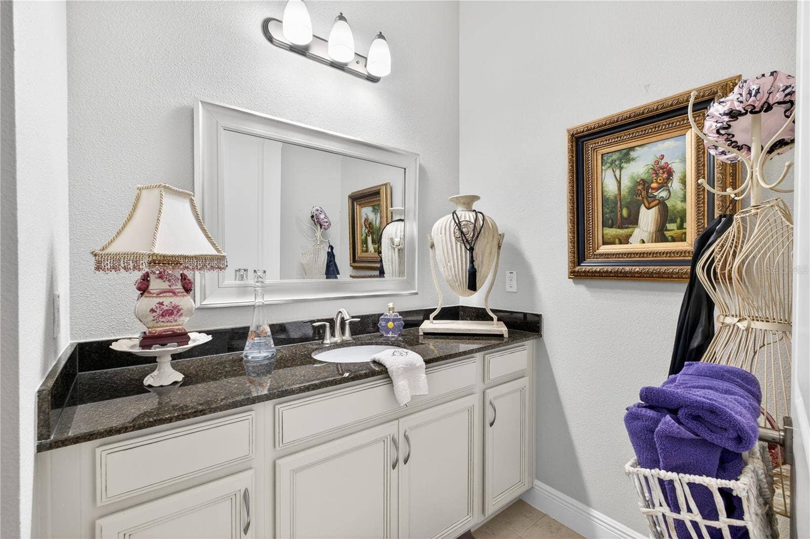 1651 AMSEL FALLS PARK TERRACE, Winter Garden, FL 34787 Vanity featuring mirror on the wall on upper level.