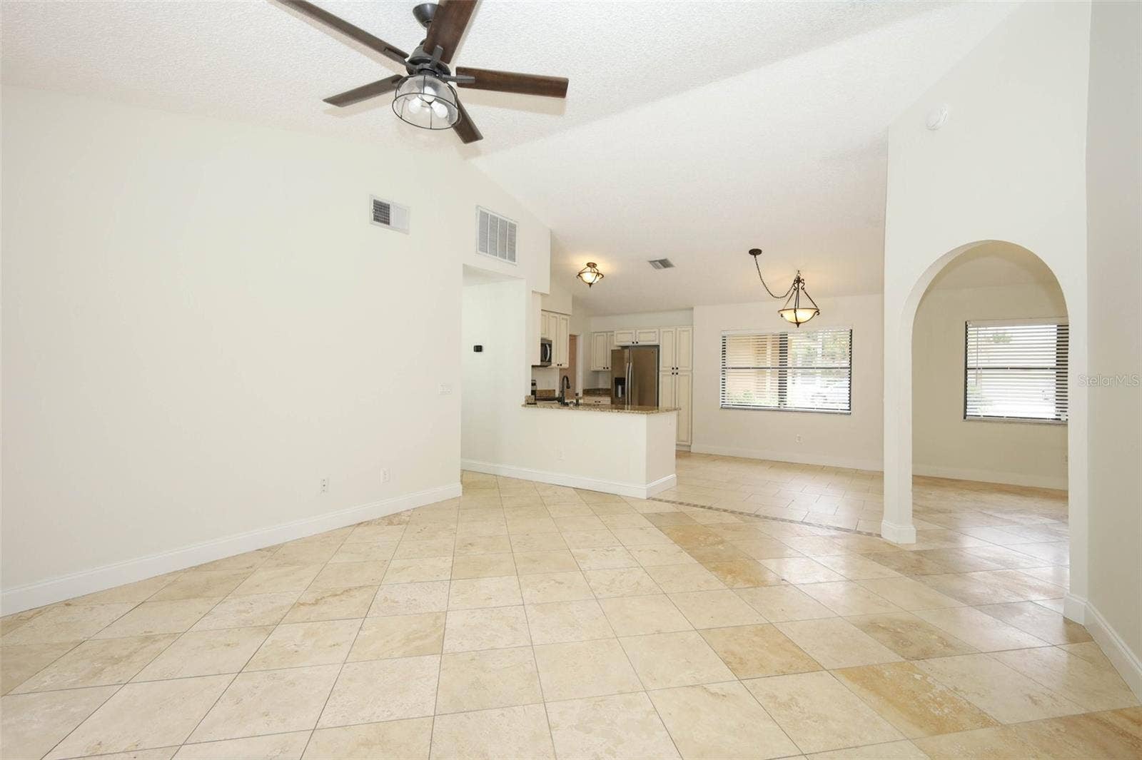Family room with Travertine tile flooring.