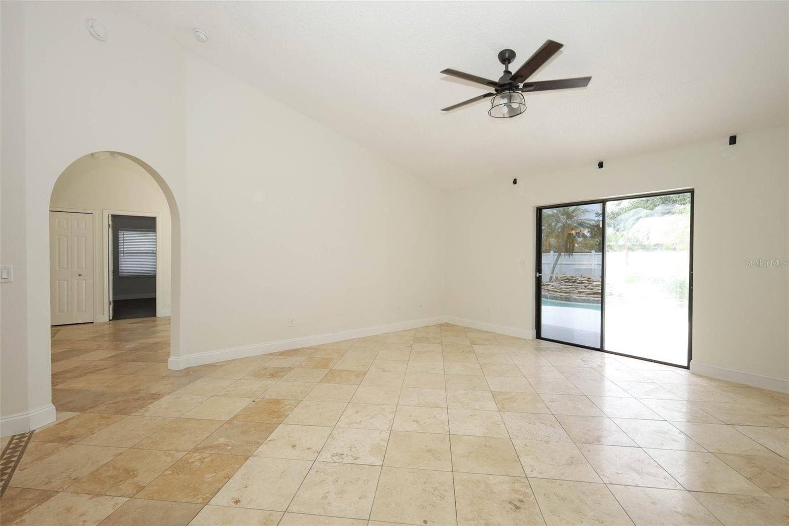 Family room with Travertine tile flooring.