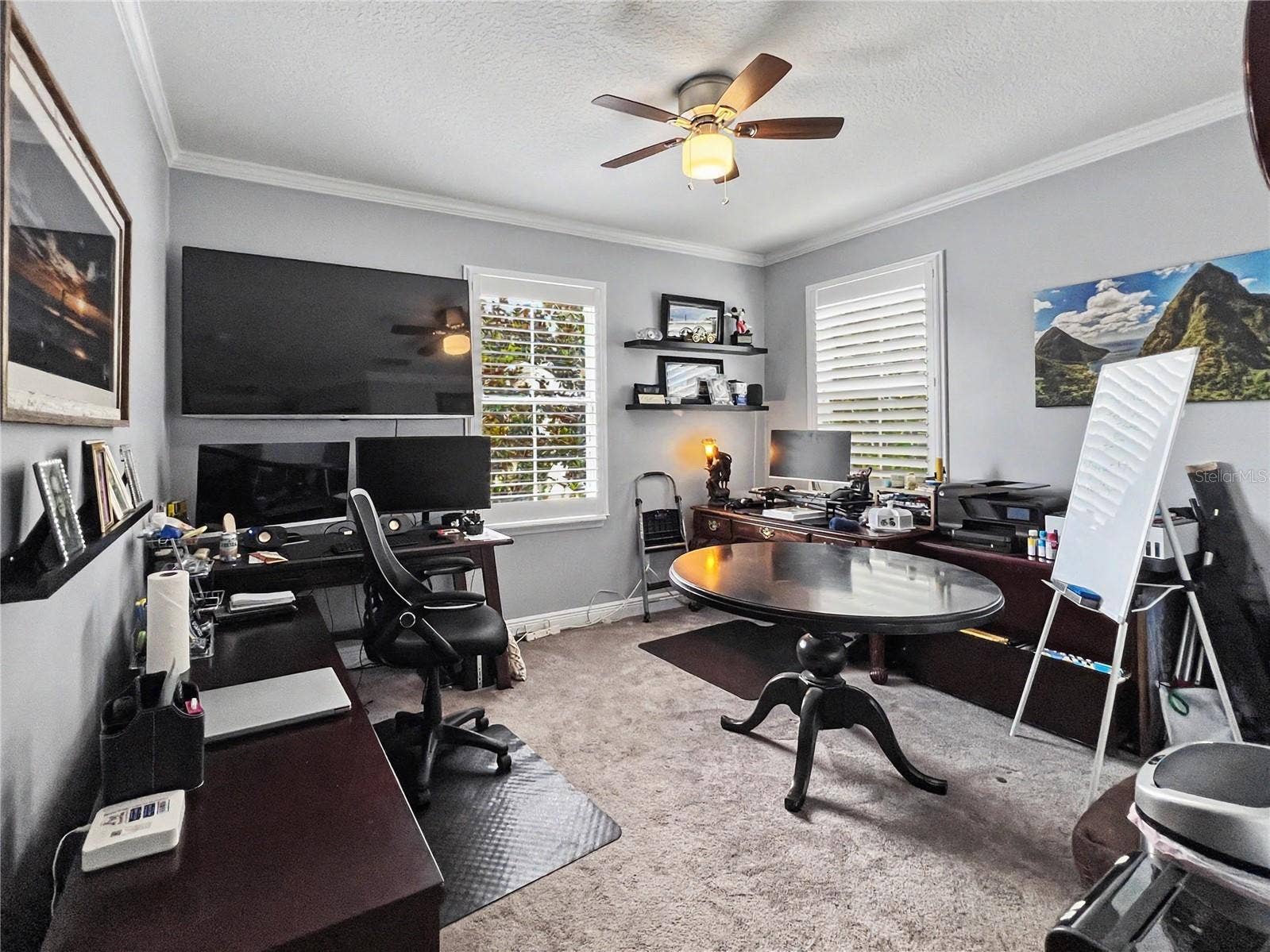 4th bedroom presently used as office , plantation shutters and ceiling fans