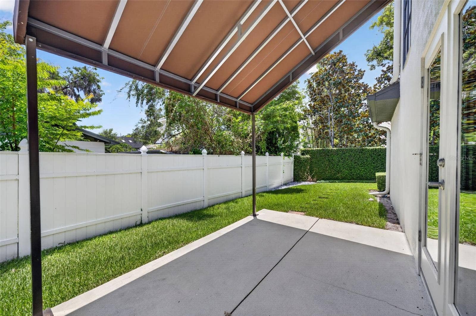 1265 ARLINGTON PL, Winter Park, FL 32789 Deck with awning in side yard