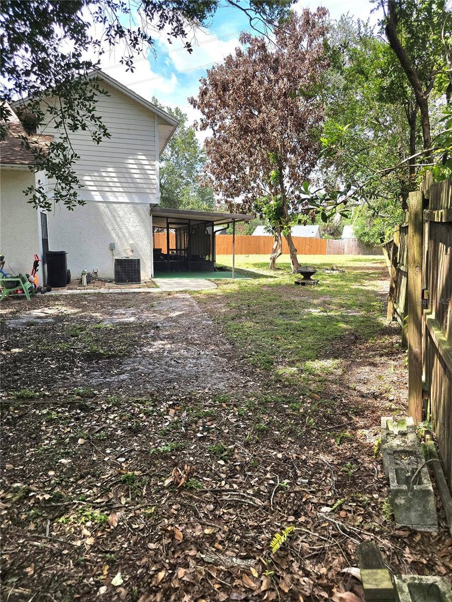8433 COMMANDER COVE, Winter Park, FL 32792 South Side of House view 2