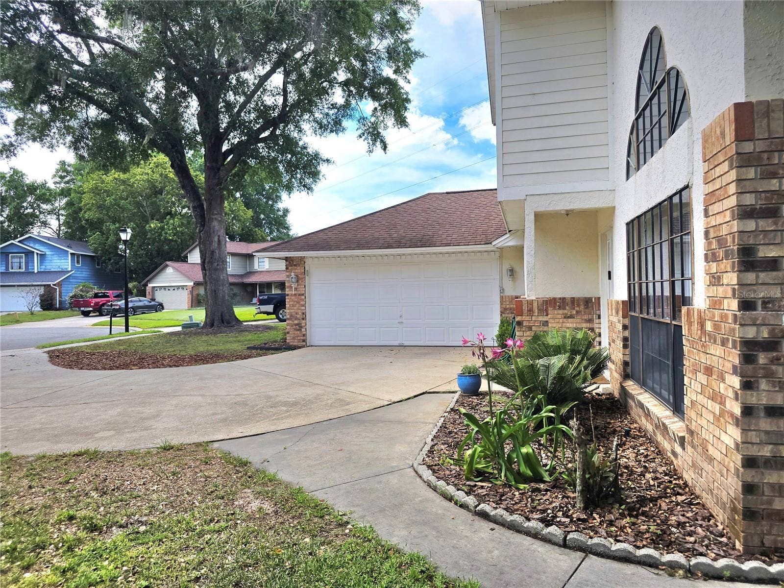 8433 COMMANDER COVE, Winter Park, FL 32792 Front house with garage
