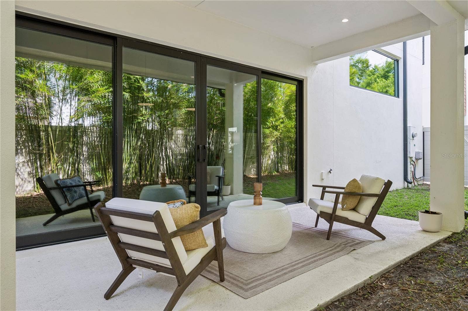 512 W SWOOPE AVENUE, Winter Park, FL 32789 40' x 20' private fenced-in backyard, including a covered patio which extends from the sliding doors.