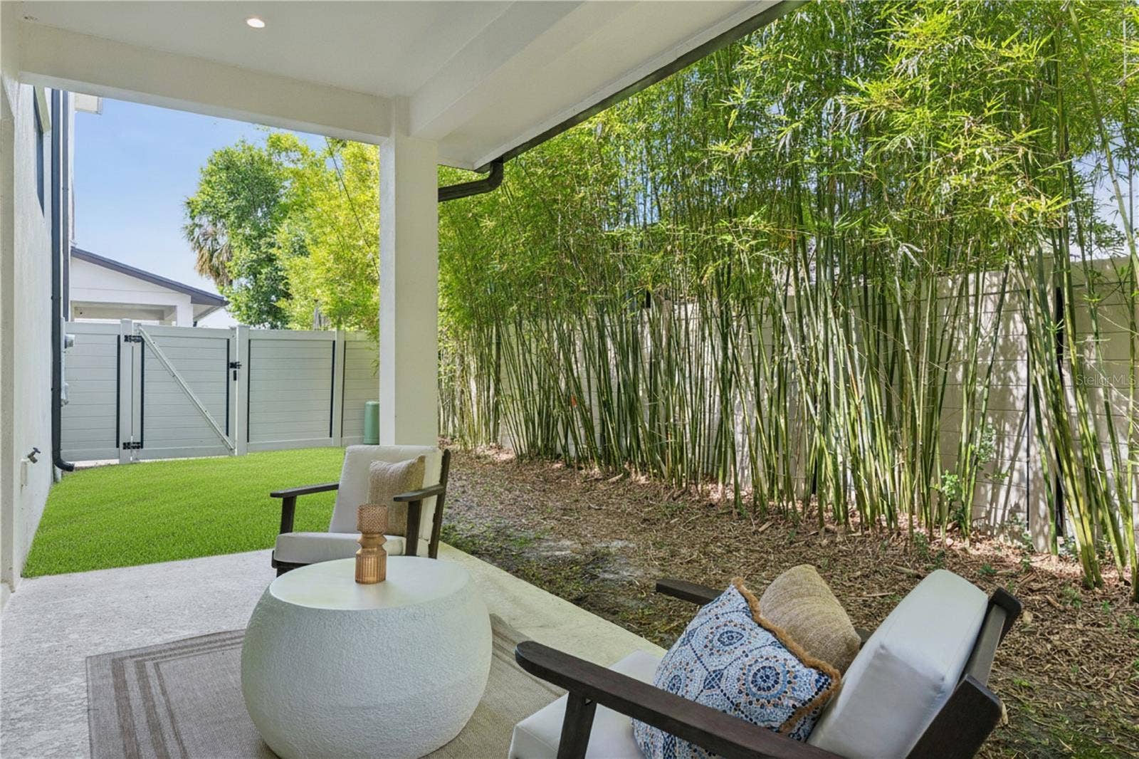 512 W SWOOPE AVENUE, Winter Park, FL 32789 40' x 20' private fenced-in backyard, including a covered patio which extends from the sliding doors.