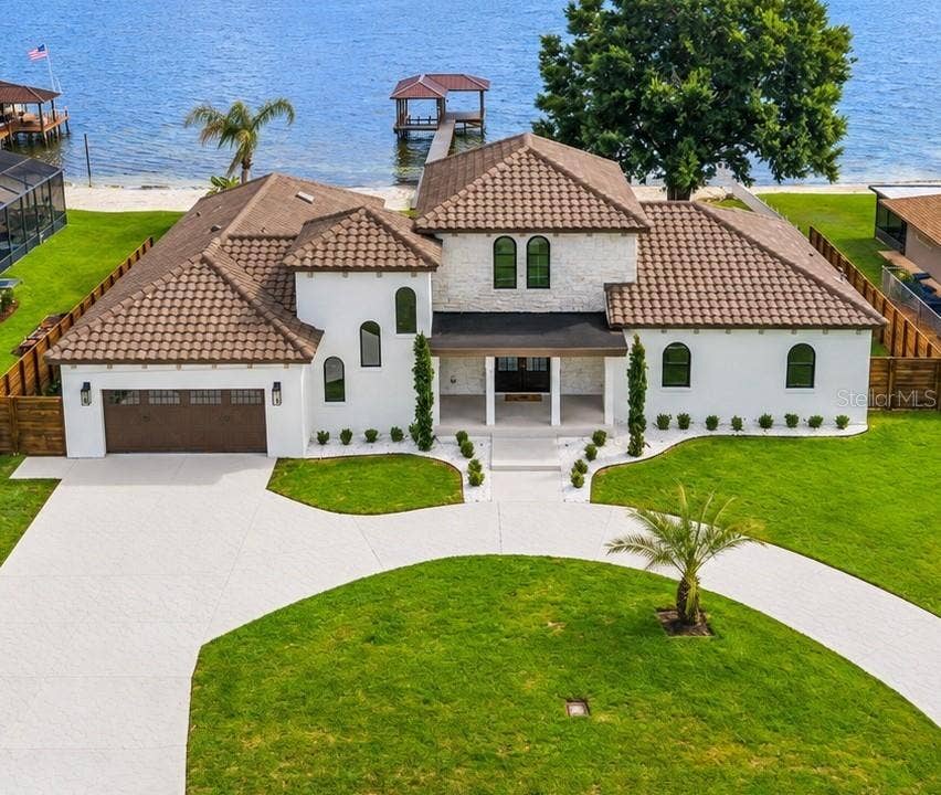 2501 TRENTWOOD BOULEVARD, Belle Isle, FL 32812 AERIAL VIEW HIGHLIGHTING CUSTOM LANDSCAPING AND LAKE CONWAY