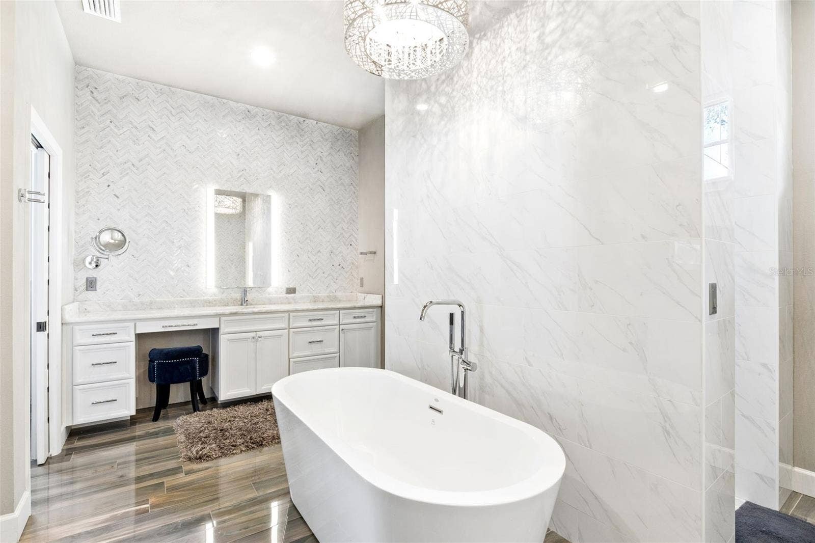 1629 HEMPEL AVENUE, Windermere, FL 34786 Marble Walls and Ceiling to Counter glass tiled backspace, backglowing mirrors and attached hanging magnifying mirror.