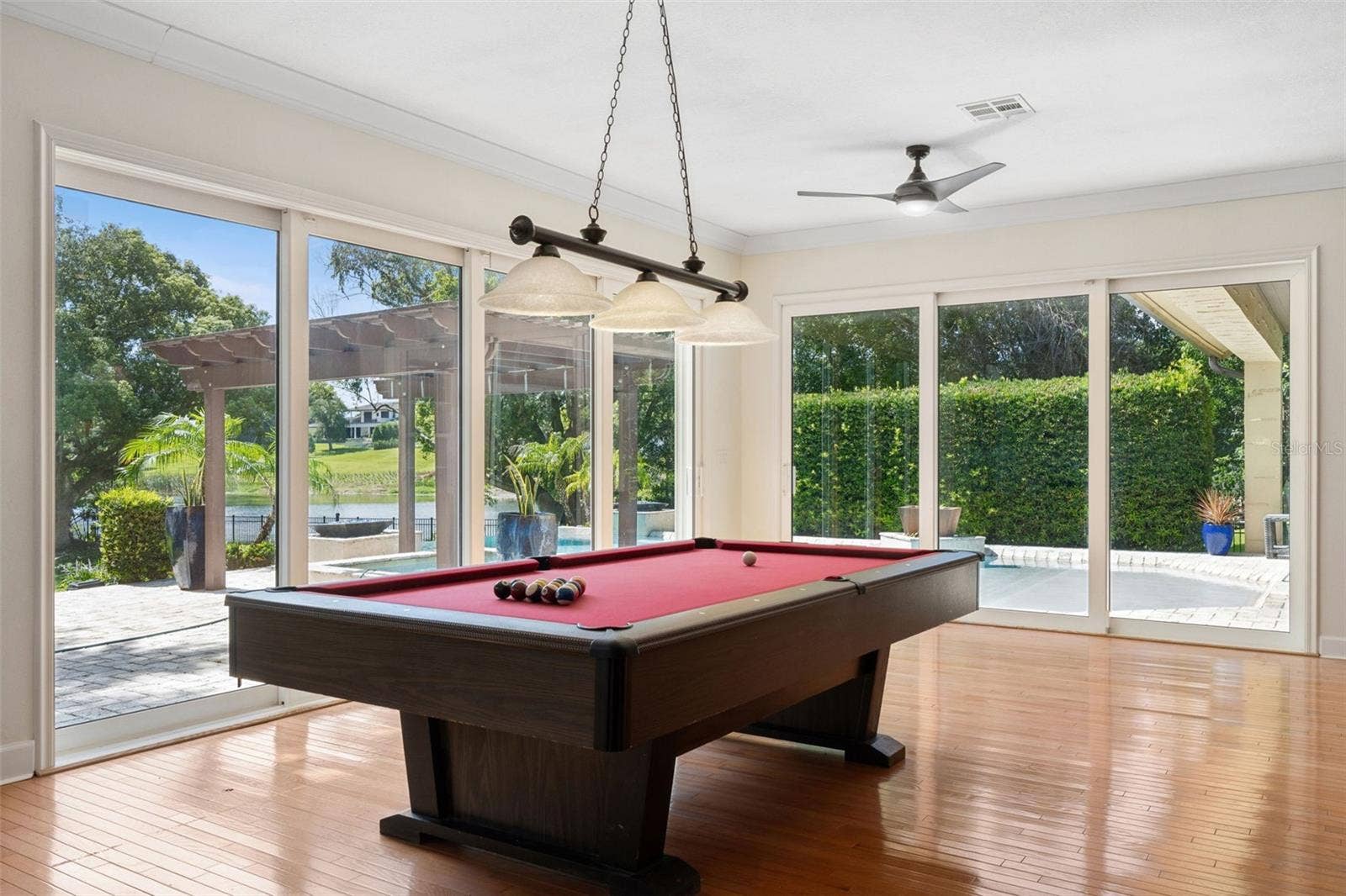 1629 HEMPEL AVENUE, Windermere, FL 34786 Game area of the GREAT ROOM. Large Sliding doors to open up the fresh air and always the view of the Lake and natural light