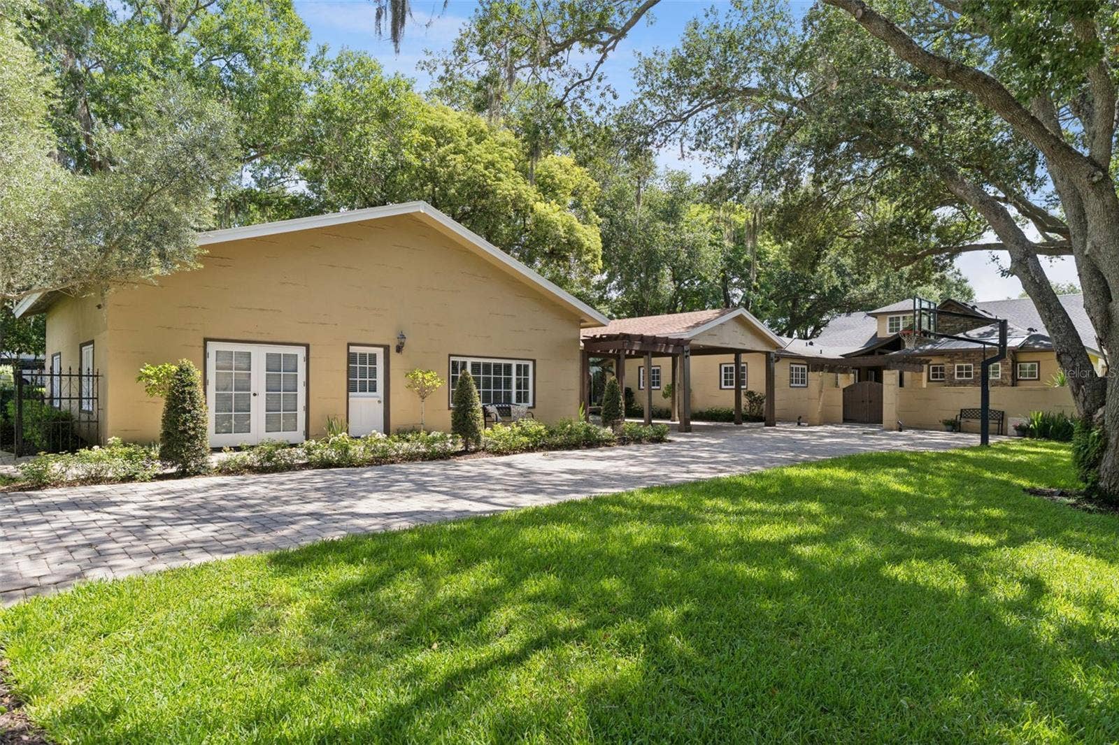 1629 HEMPEL AVENUE, Windermere, FL 34786 Guest house, Porte Cochere and Main Home. Long paver driveway