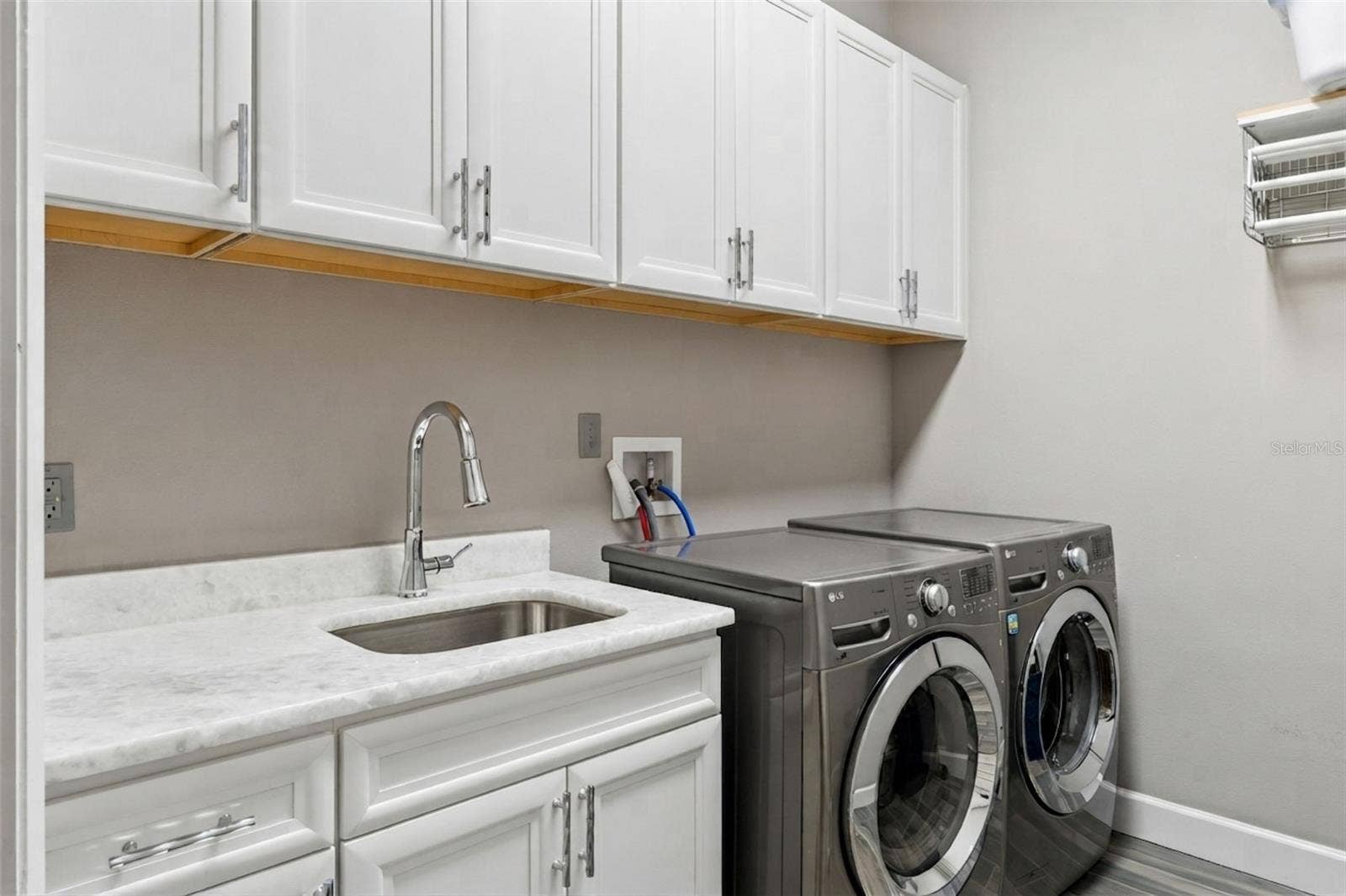 1629 HEMPEL AVENUE, Windermere, FL 34786 Private Laundry in Primary Suite. Complete with Sink, Cabinets and Drying Racks