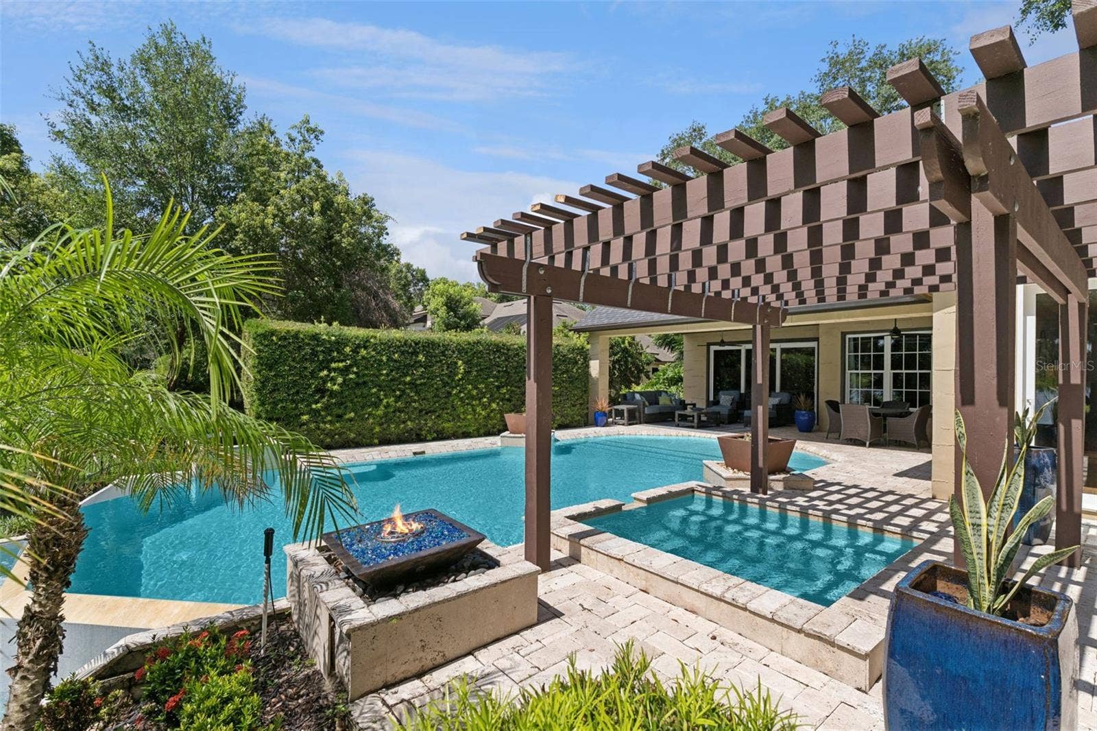 1629 HEMPEL AVENUE, Windermere, FL 34786 Hot tub with fire pit feature. Large enough for six but I prefer just two