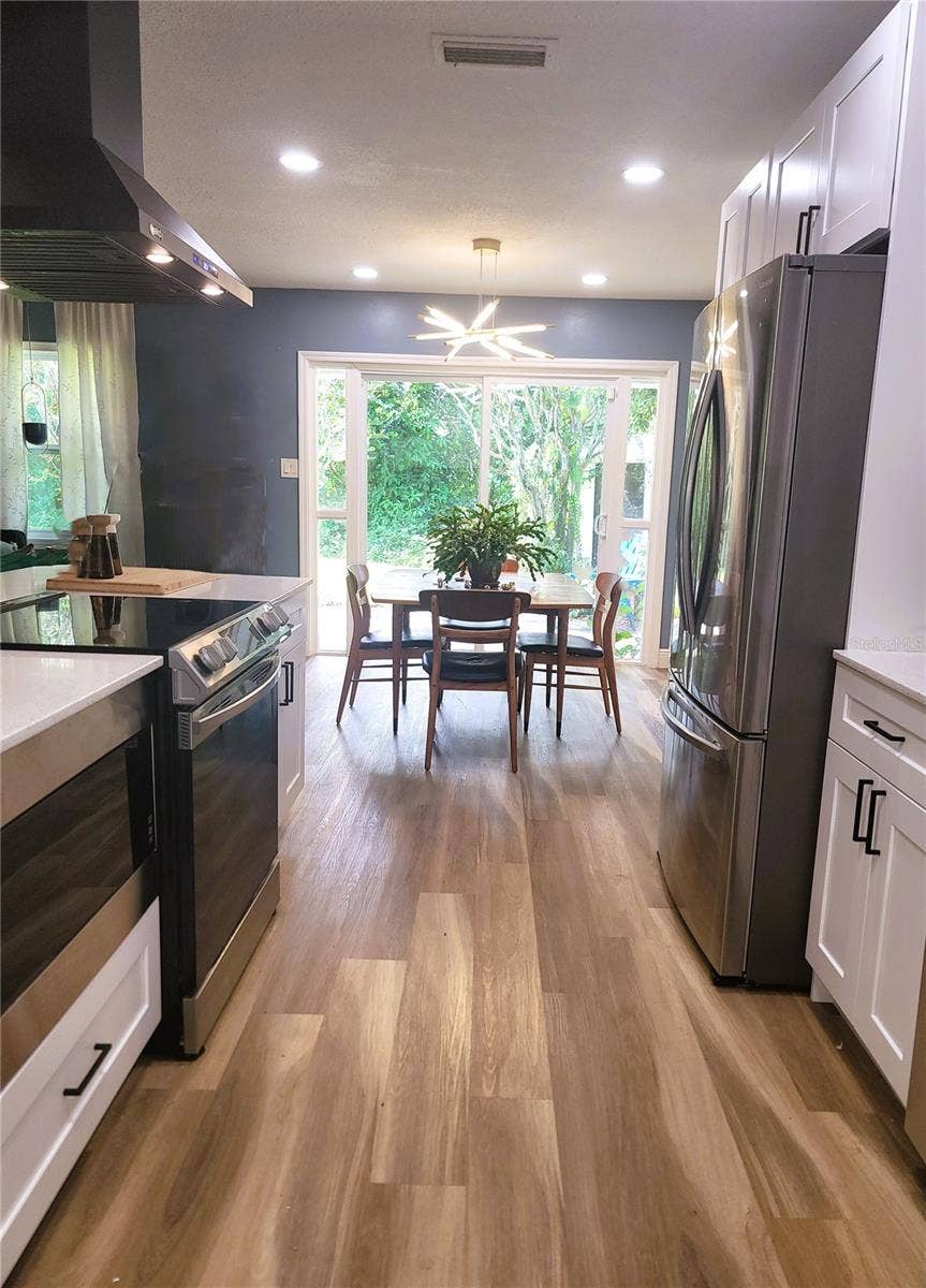 2732 WALNUT STREET, Orlando, FL 32806 SS appliances and hard floors thru-out. Lots of natural light and pretty back-yard views