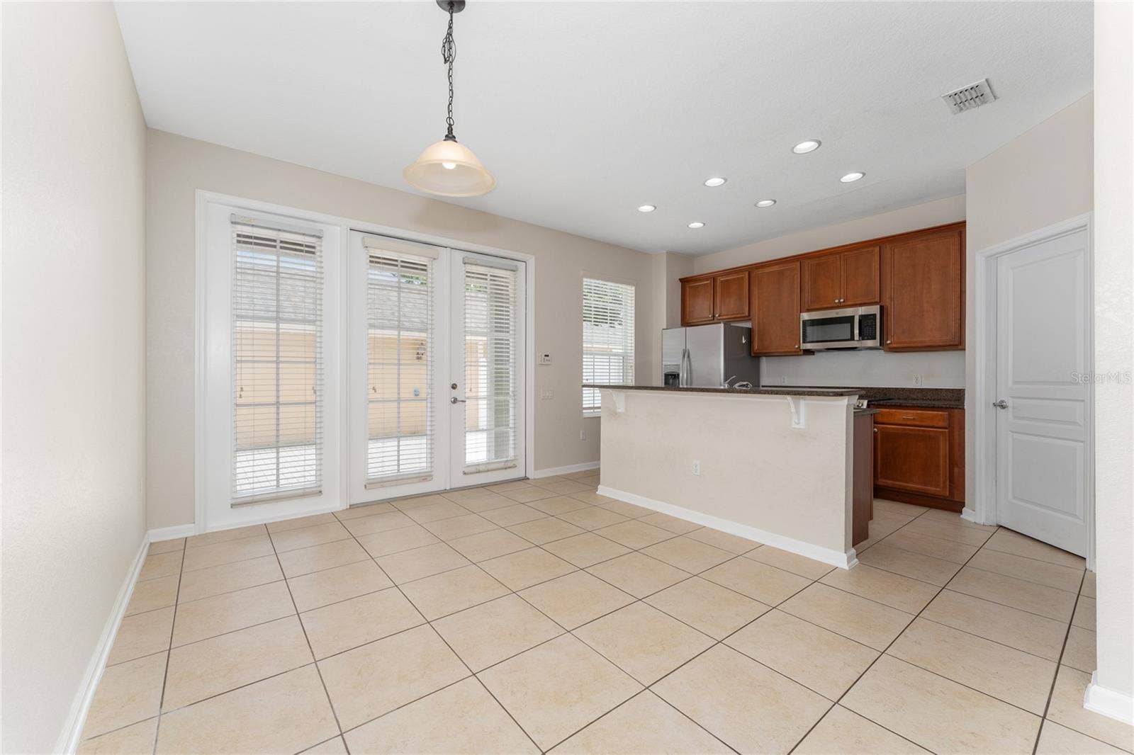 7723 FAIRGROVE AVENUE, Windermere, FL 34786 Dining room and kitchen