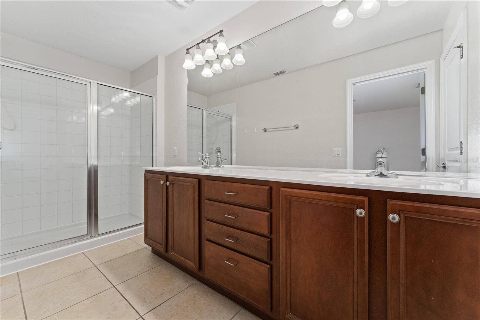 7723 FAIRGROVE AVENUE, Windermere, FL 34786 Master bathroom with dual sinks and walk-in shower