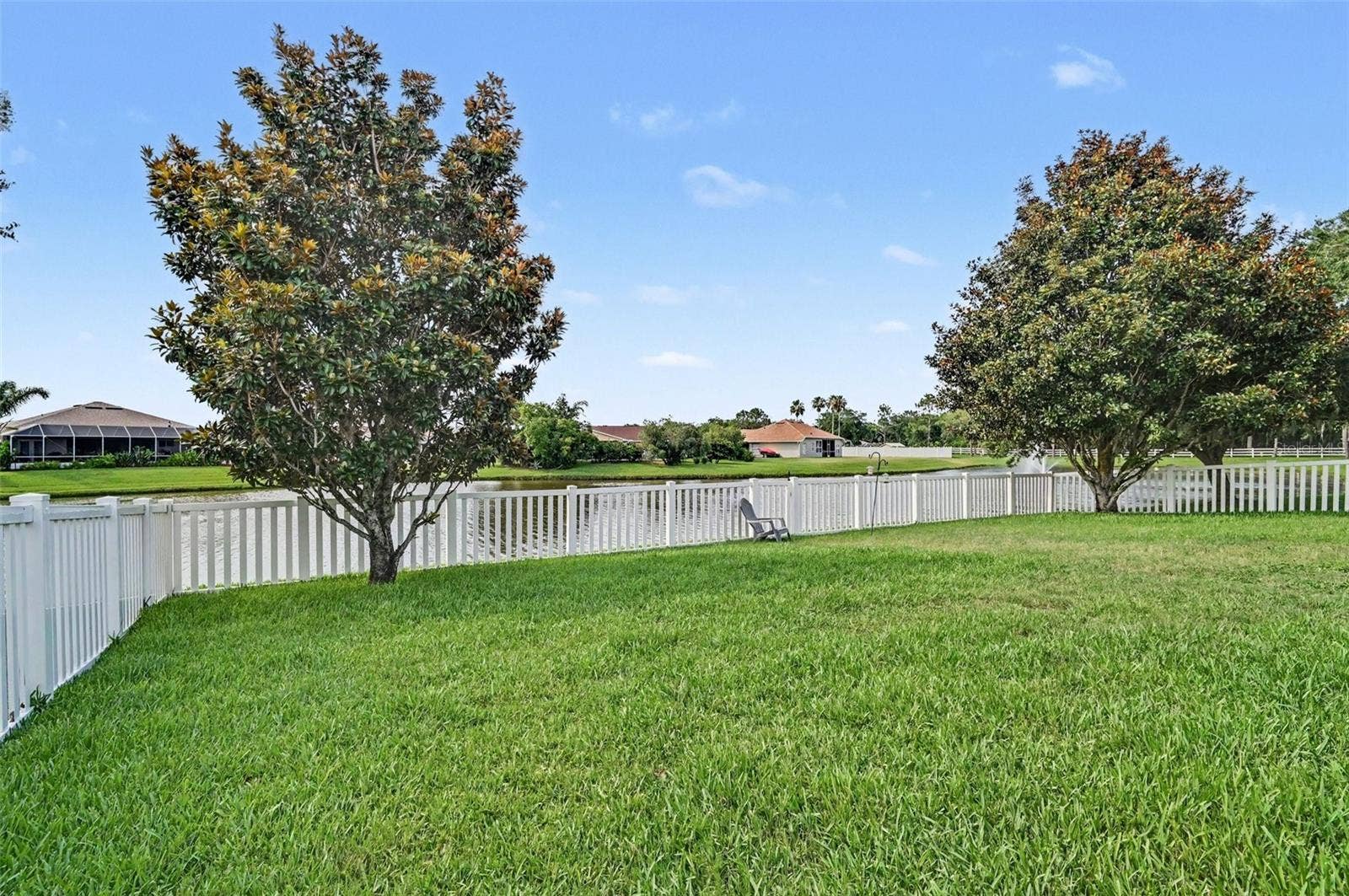 Back yard fenced in on the lake