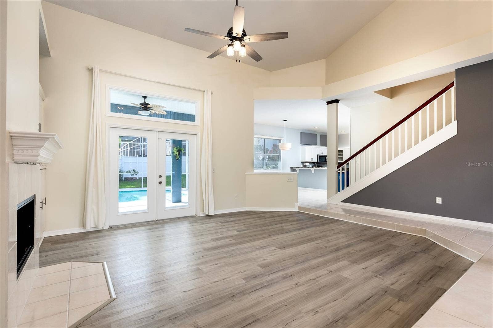 Living Room to kitchen and pool deck
