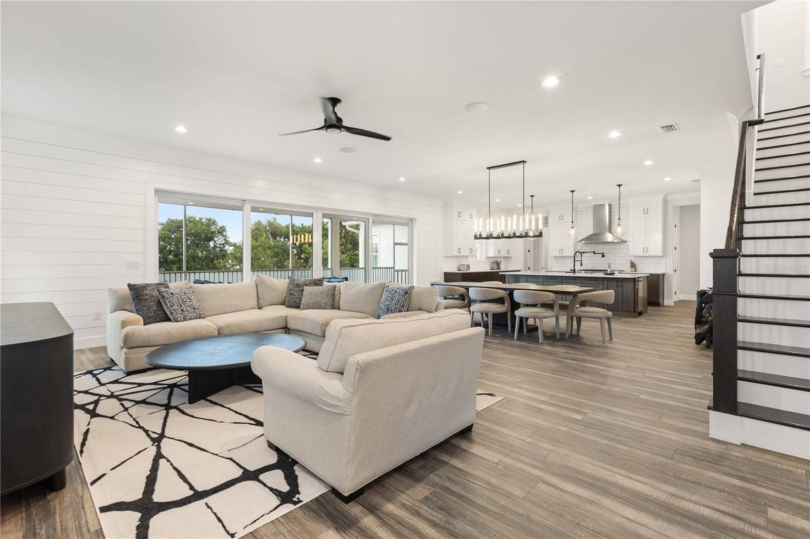 907 CELADON STREET, Winter Garden, FL 34787 Open living, dining and Chef's kitchen.