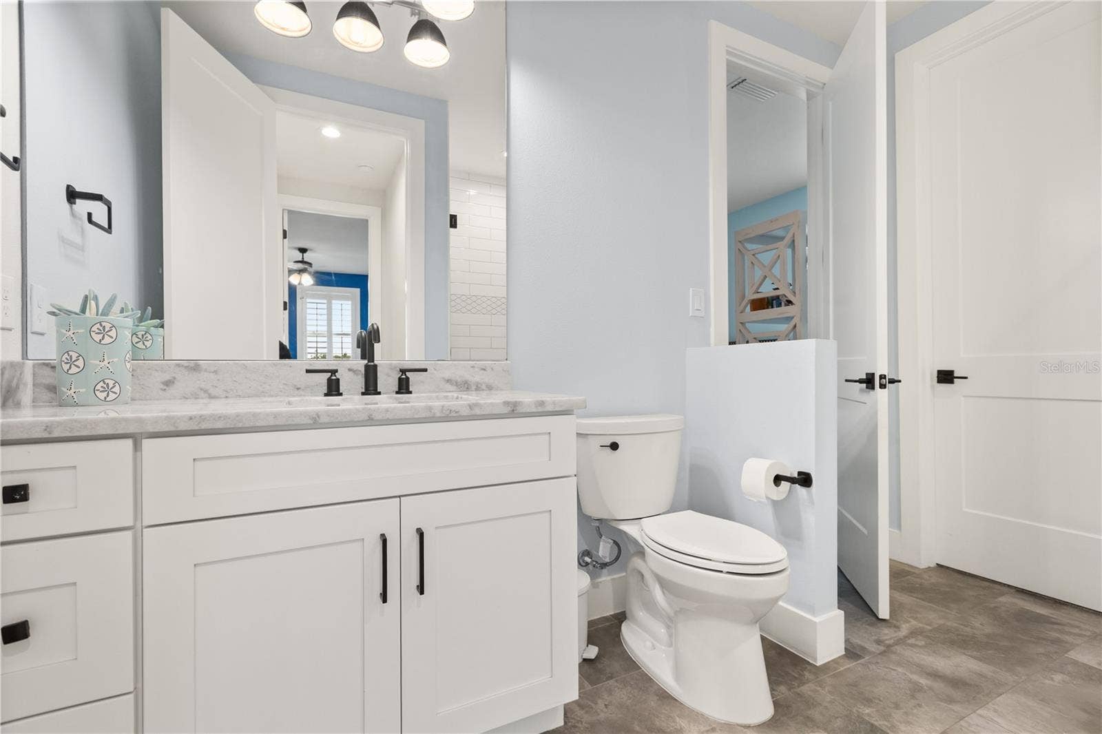 907 CELADON STREET, Winter Garden, FL 34787 Second floor, Full bathroom with double access. Entry shown from 3rd bedroom immediately off the loft.