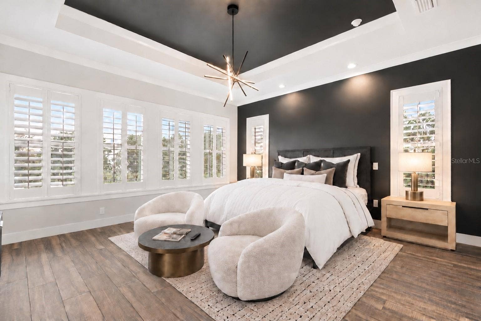 907 CELADON STREET, Winter Garden, FL 34787 Virtual staged. Bedding, chairs, round table, lamps.