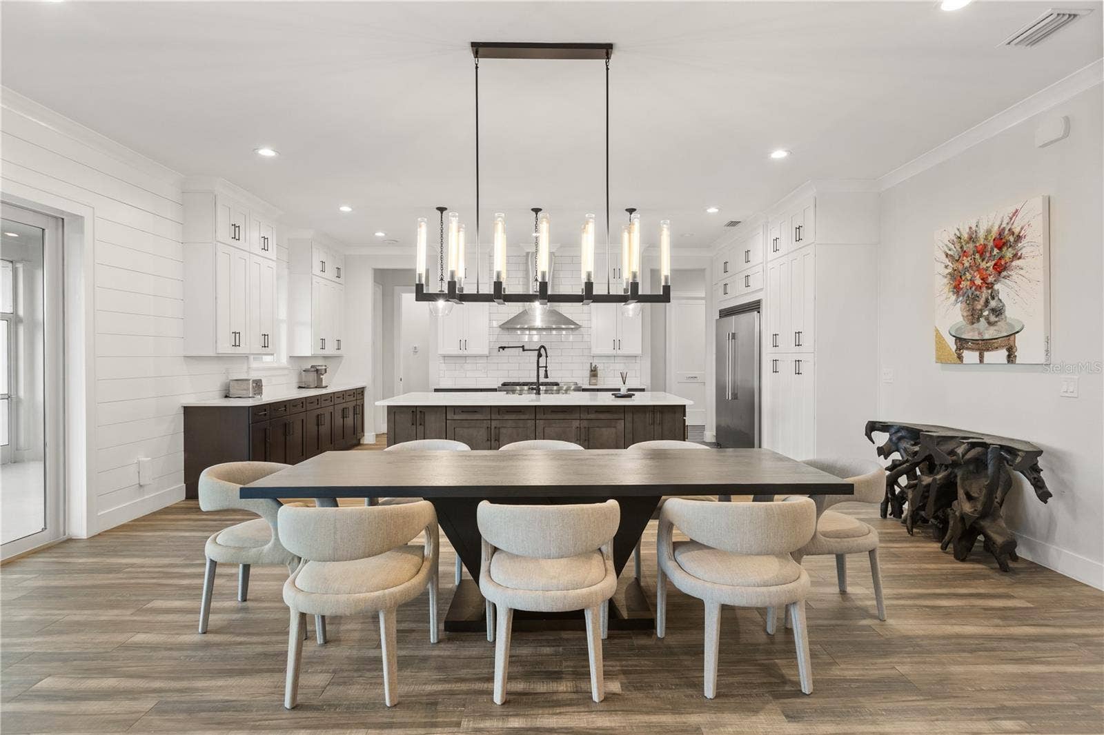907 CELADON STREET, Winter Garden, FL 34787 Designer dining table, chairs seats 8. Updated chandelier.
