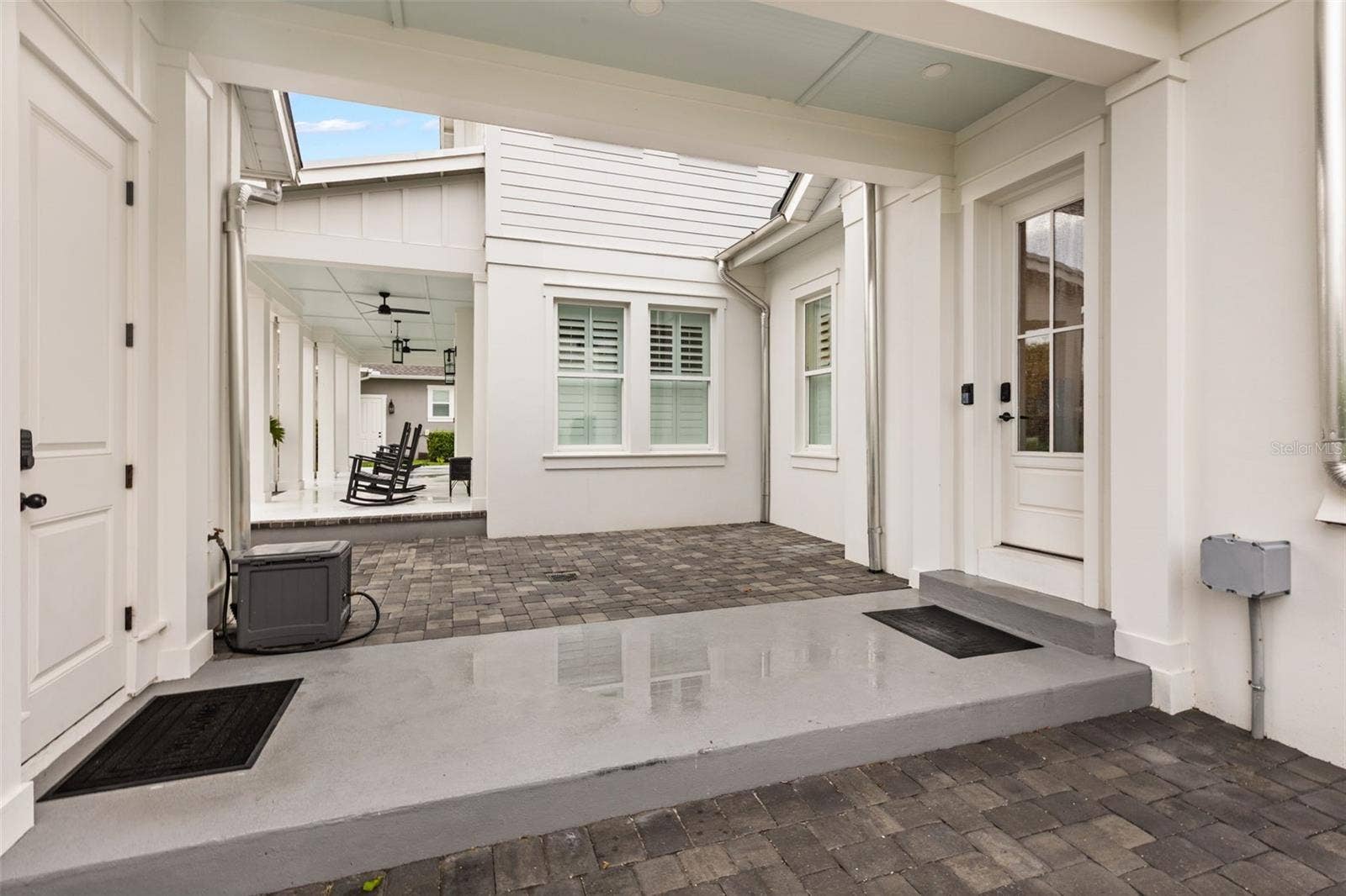 907 CELADON STREET, Winter Garden, FL 34787 Breezeway connecting Carriage House garage (left), to private back entrance into Main House.