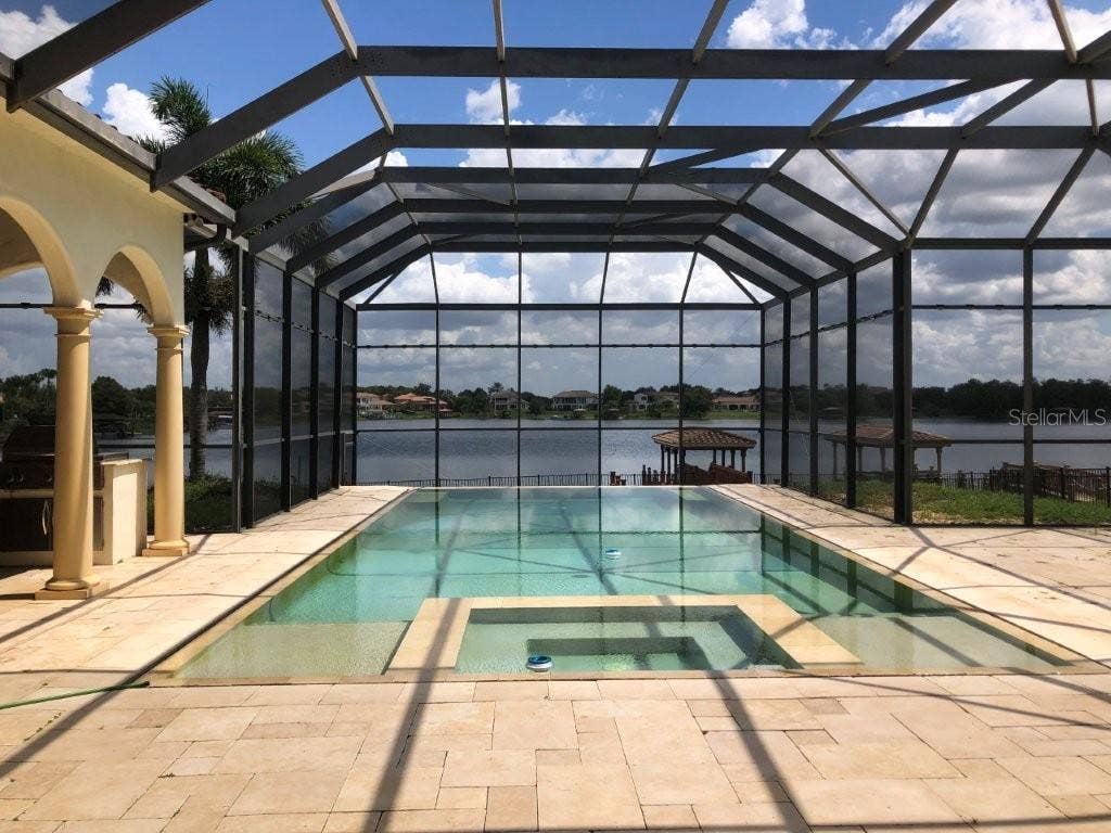 1238 LAKE WHITNEY DRIVE, Windermere, FL 34786 In-ground pool with screen enclosure