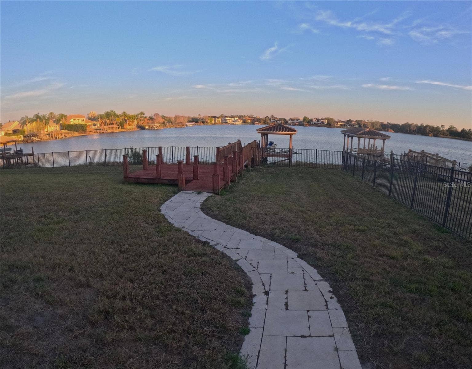 1238 LAKE WHITNEY DRIVE, Windermere, FL 34786 View of rear dock & lake-frontage at sunset