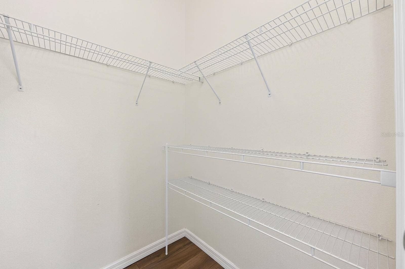11429 BROWNSTONE STREET, Windermere, FL 34786 Primary suite walk-in closet.