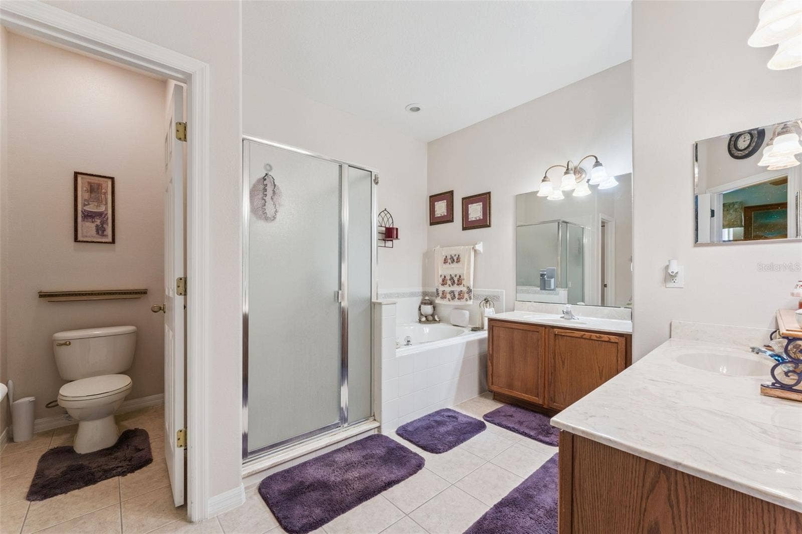 9955 MEDALLION BLUFF LANE, Orlando, FL 32829 Primary bathroom features a private water closet