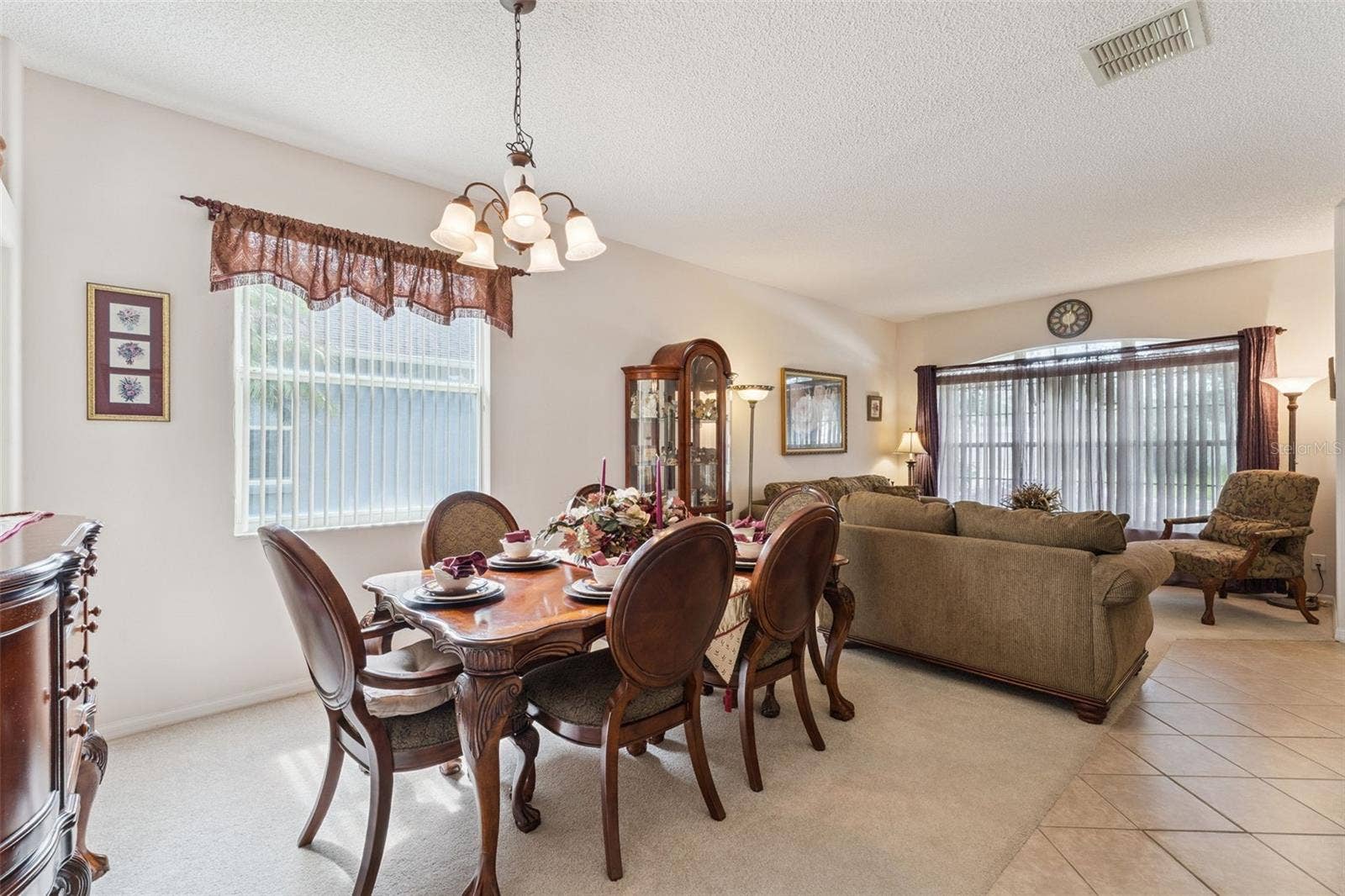 9955 MEDALLION BLUFF LANE, Orlando, FL 32829 Dining Room with Living Room View