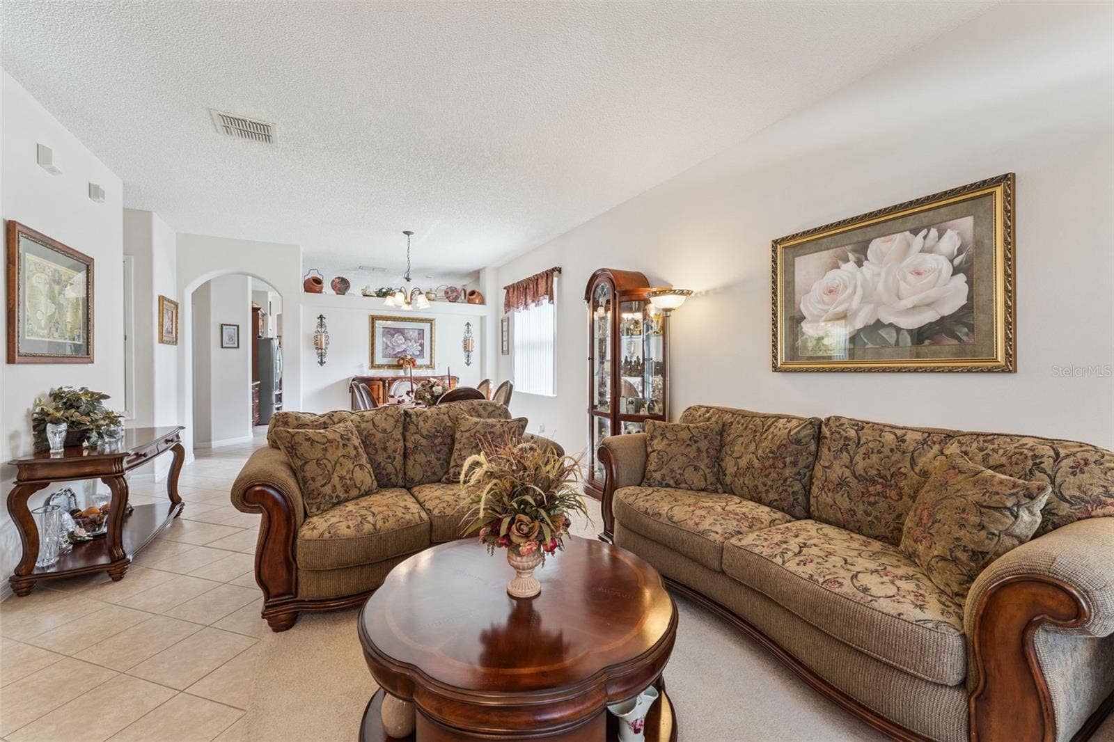 9955 MEDALLION BLUFF LANE, Orlando, FL 32829 Living Room with Dining Room View