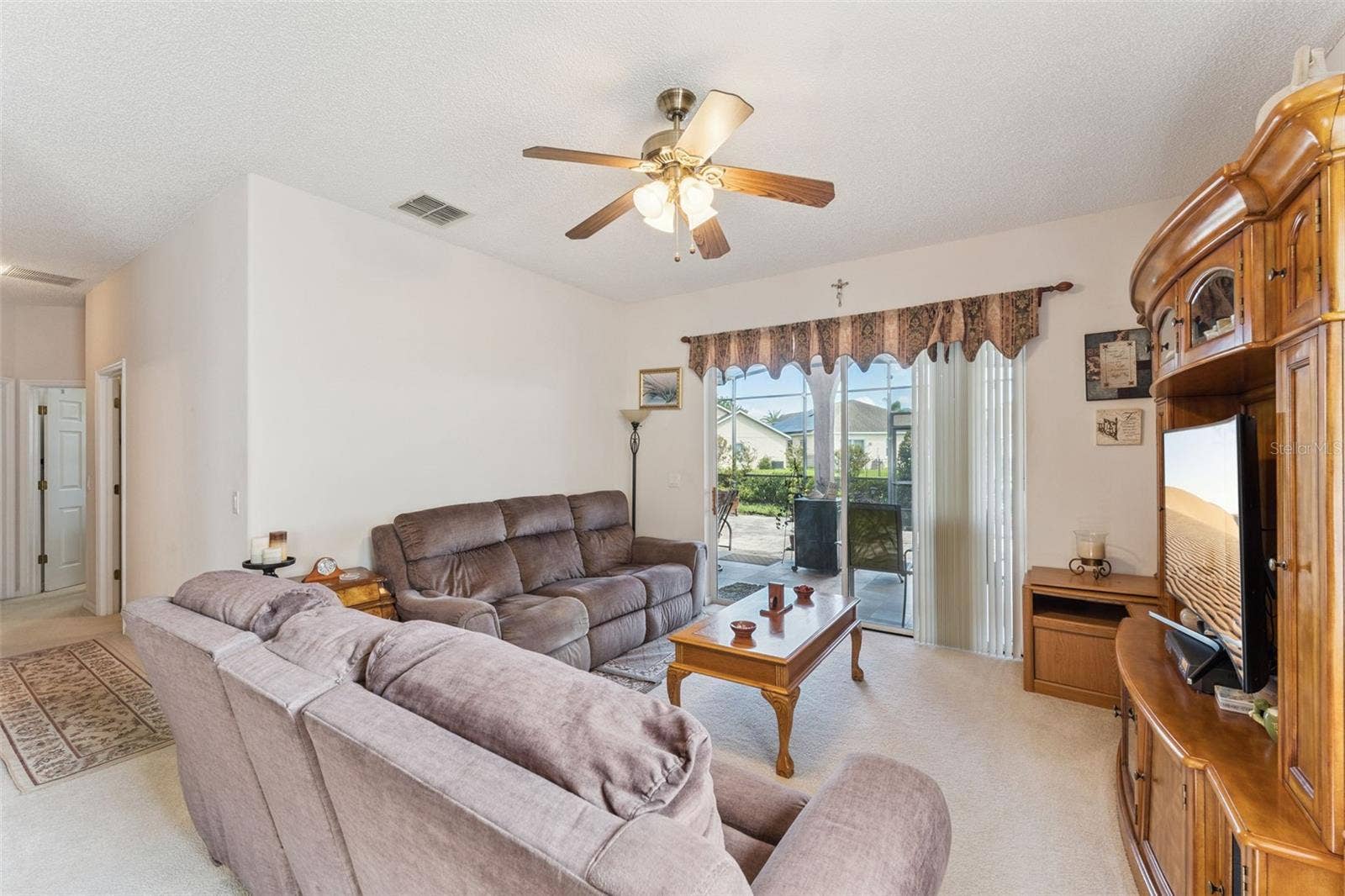 9955 MEDALLION BLUFF LANE, Orlando, FL 32829 Family Room with Patio View