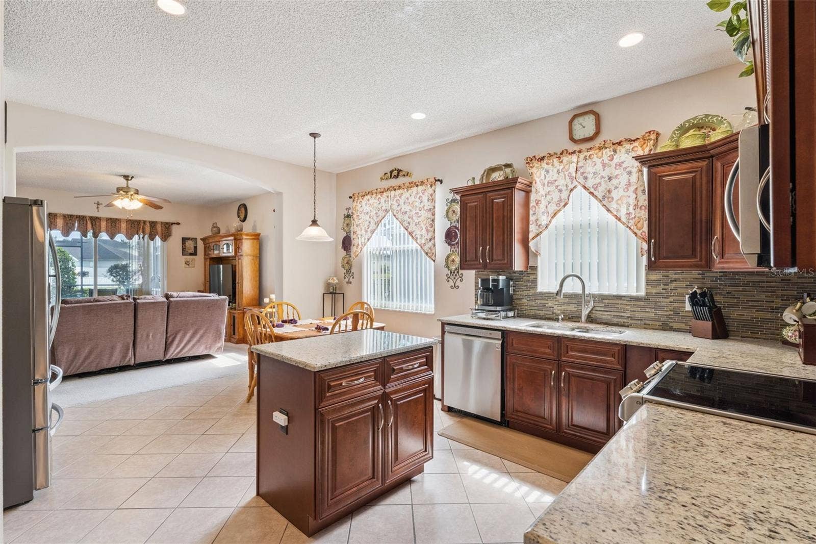 9955 MEDALLION BLUFF LANE, Orlando, FL 32829 Kitchen with Family Room View