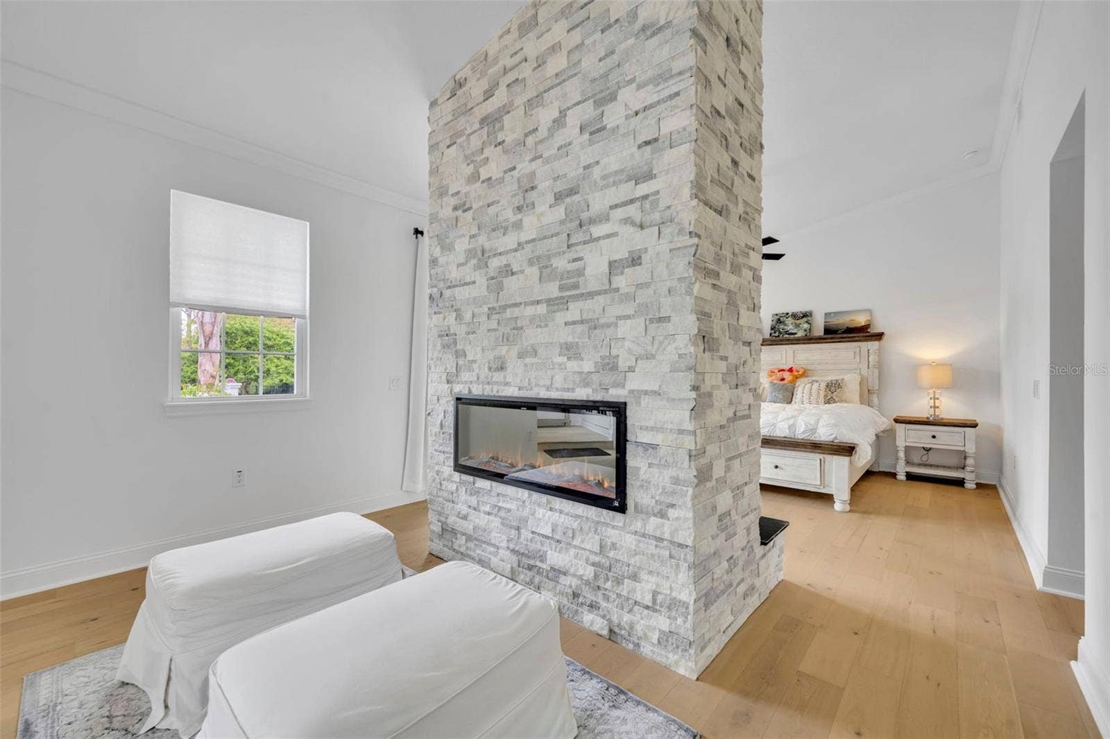 807 OAK SHADOWS ROAD, Celebration, FL 34747 Double sided fireplace in First Floor Primary Bedroom