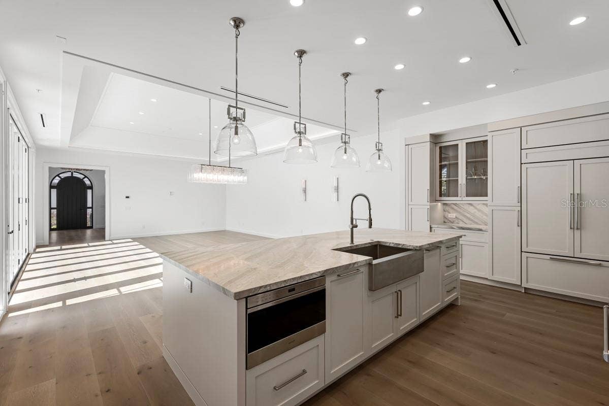 10335 WINTER SPARKLE CIRCLE, Golden Oak, FL 32836 Gourmet kitchen with frameless contemporary cabinetry and alarge prep island