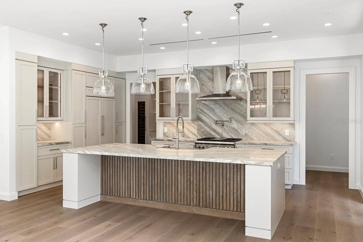 10335 WINTER SPARKLE CIRCLE, Golden Oak, FL 32836 Gourmet kitchen with frameless contemporary cabinetry and alarge prep island