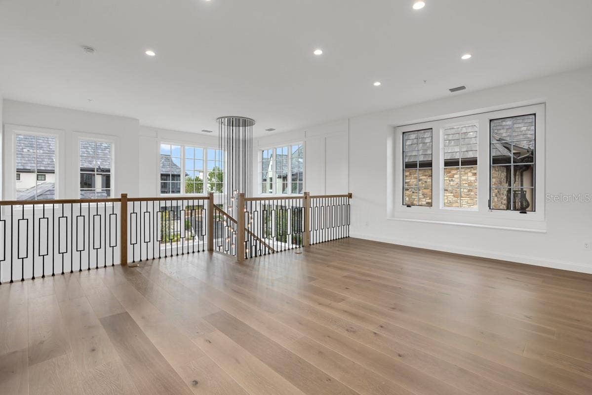 10335 WINTER SPARKLE CIRCLE, Golden Oak, FL 32836 Second-floor loft space adjacent to grand, winding staircaseopens to floor below