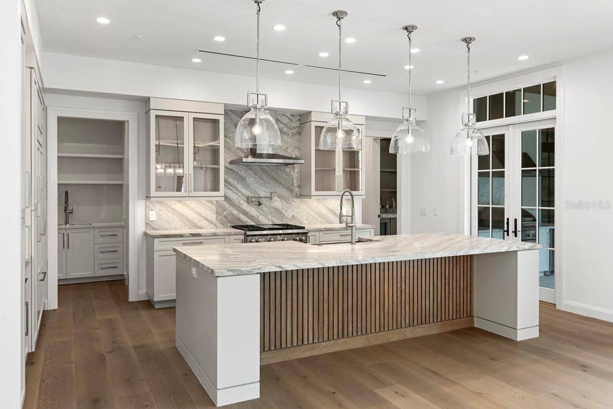 10335 WINTER SPARKLE CIRCLE, Golden Oak, FL 32836 Gourmet kitchen with frameless contemporary cabinetry and alarge prep island