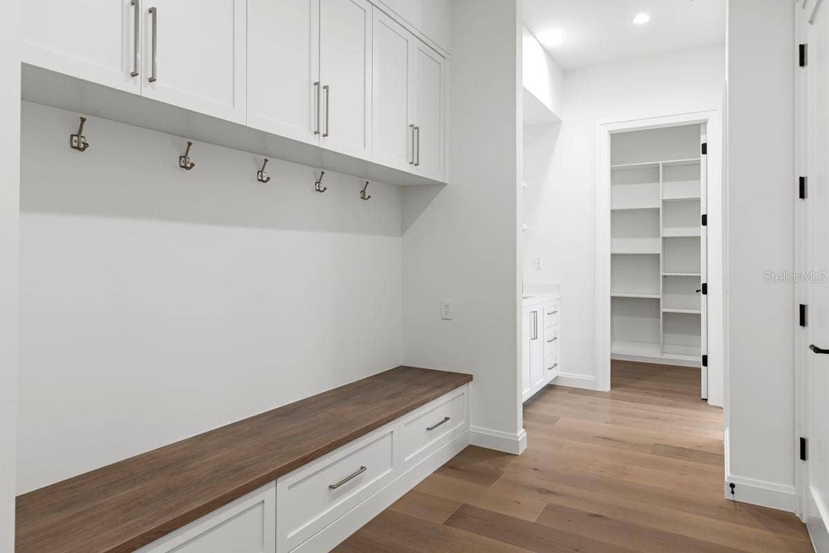 10335 WINTER SPARKLE CIRCLE, Golden Oak, FL 32836 Drop zone area with custom wood cabinetry and shelving