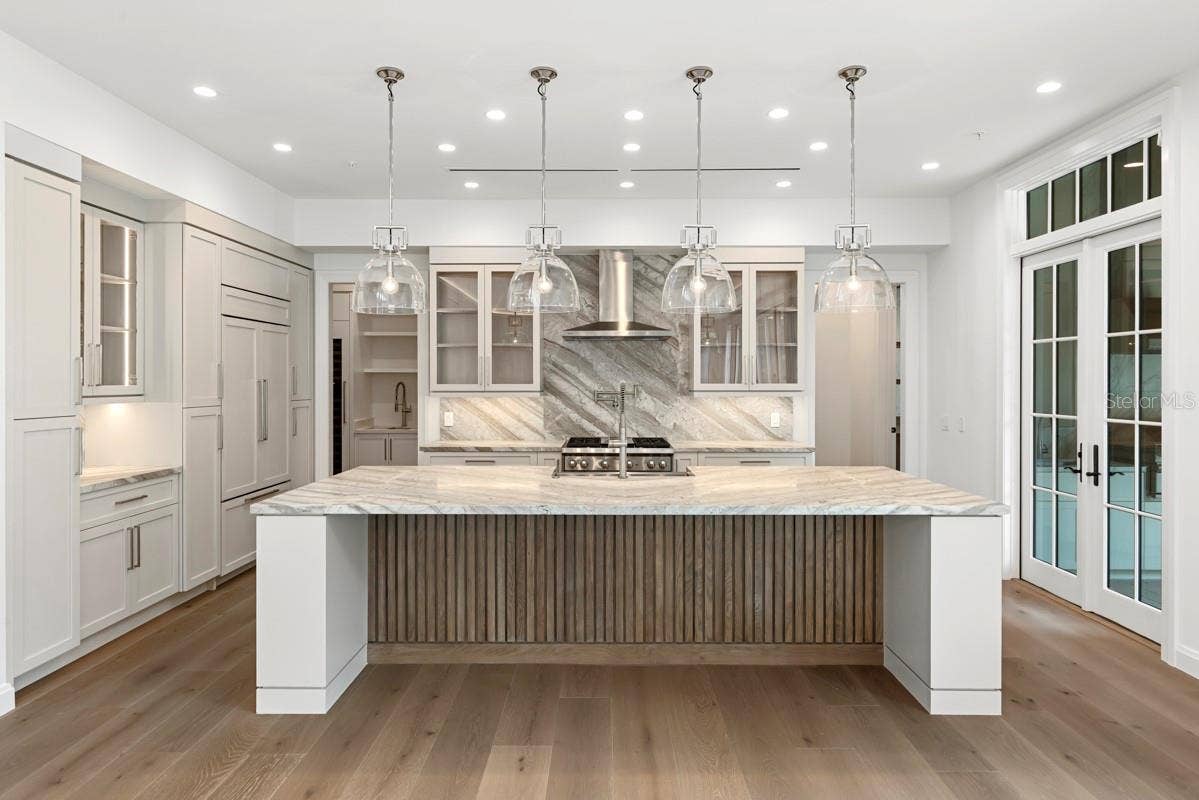 10335 WINTER SPARKLE CIRCLE, Golden Oak, FL 32836 Gourmet kitchen with frameless contemporary cabinetry and alarge prep island