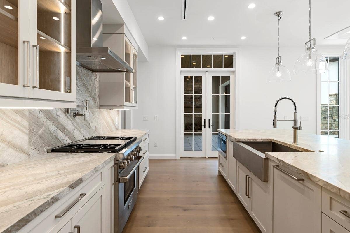 10335 WINTER SPARKLE CIRCLE, Golden Oak, FL 32836 Gourmet kitchen with frameless contemporary cabinetry and alarge prep island