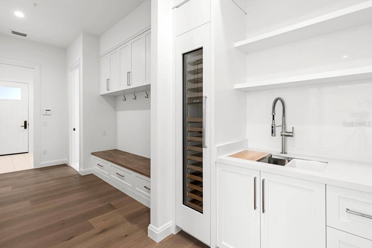 10335 WINTER SPARKLE CIRCLE, Golden Oak, FL 32836 Butlers pantry directly off kitchen with walk-in pantry featuringcustom-built shelving and cabinetry